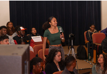 student in audience with mic